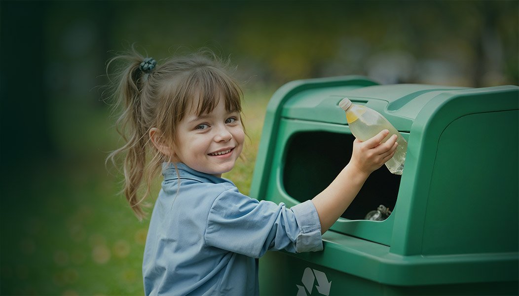 girl-recycling-plastic-bottle